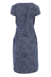 Product shot of the Victoria Dress in colour LinearFlor (Blue), from the back