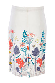 Product shot of the Border Print Fitted Skirt in colour Floralmead (White), from the back
