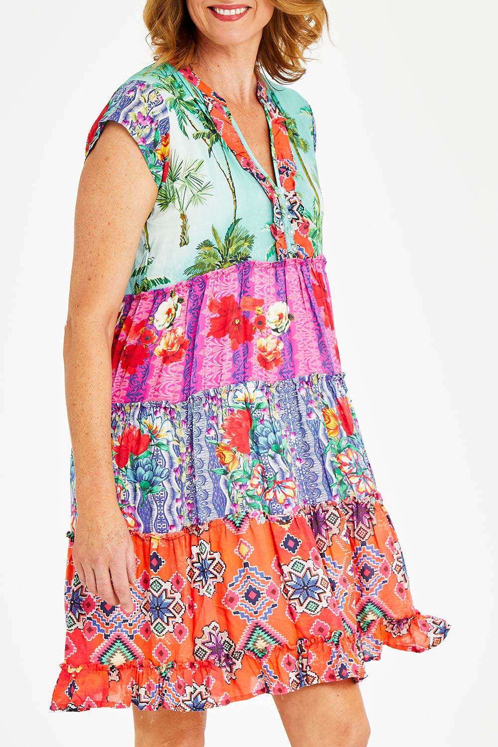 Model Naomi wearing size S of the California Tiered Dress in colour Ocean (Pink), from the front, cropped image