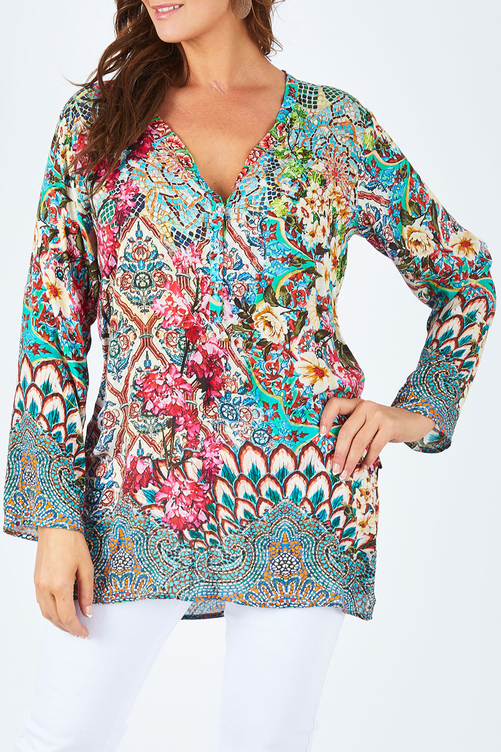 Model Abby wearing size L of the Lindeman Tunic in colour Multi (Pink), from the front, cropped image