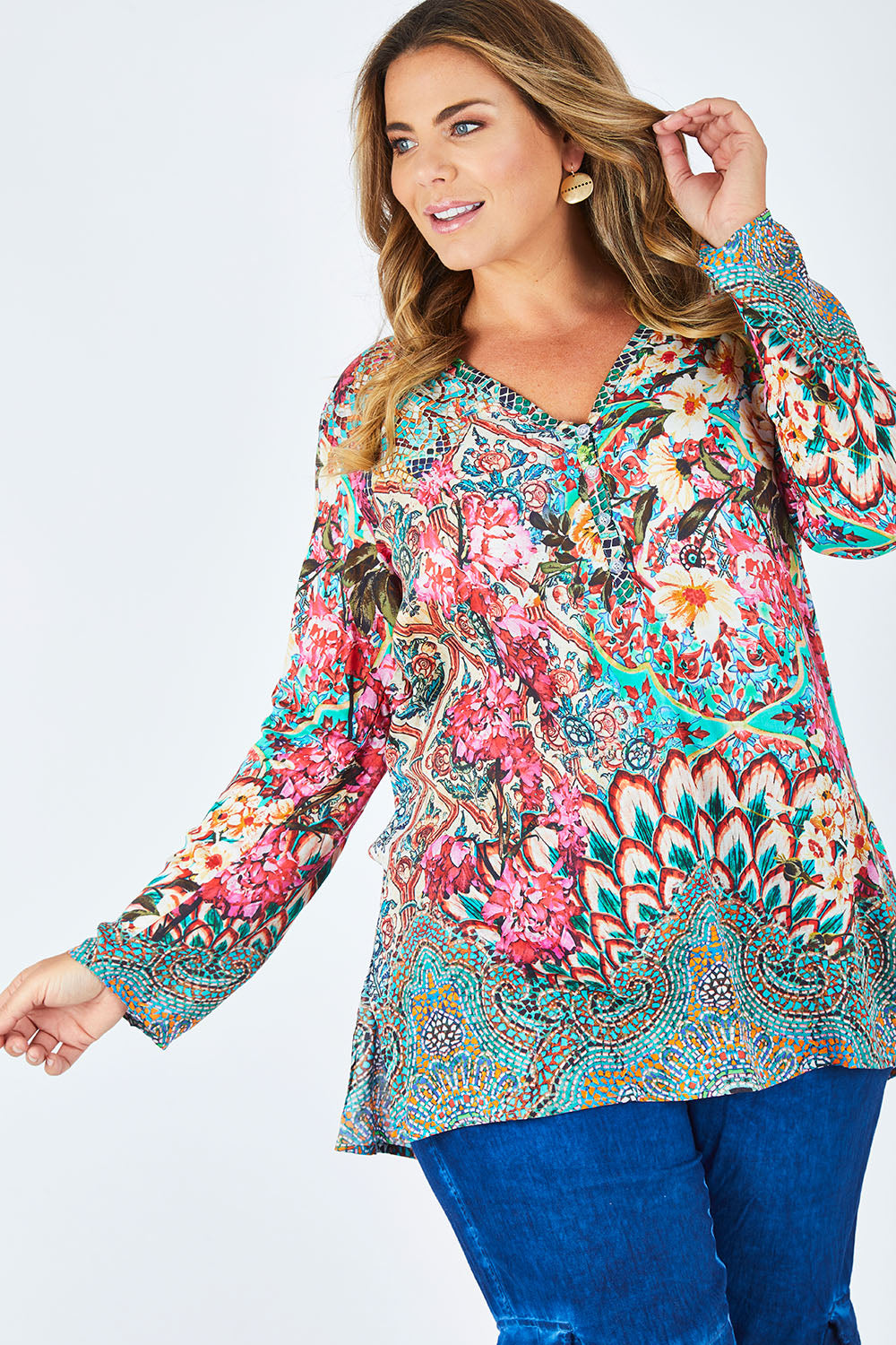 Model Fiona wearing size XL of the Lindeman Tunic in colour Multi (Pink), from the front, cropped image
