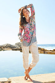 Model Michelle wearing size S of the Lindeman Tunic in colour Multi (Pink), from the front, showing the whole outfit