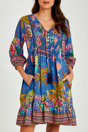 Model Madeline wearing size S of the Mika Dress in colour Ocean (Blue), from the front, cropped image
