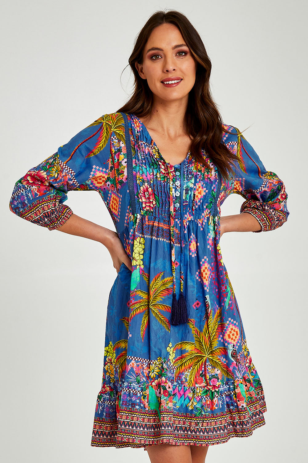 Model Madeline wearing size S of the Mika Dress in colour Ocean (Blue), from the front, cropped image