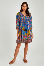 Model Madeline wearing size S of the Mika Dress in colour Ocean (Blue), from the front, showing the whole outfit