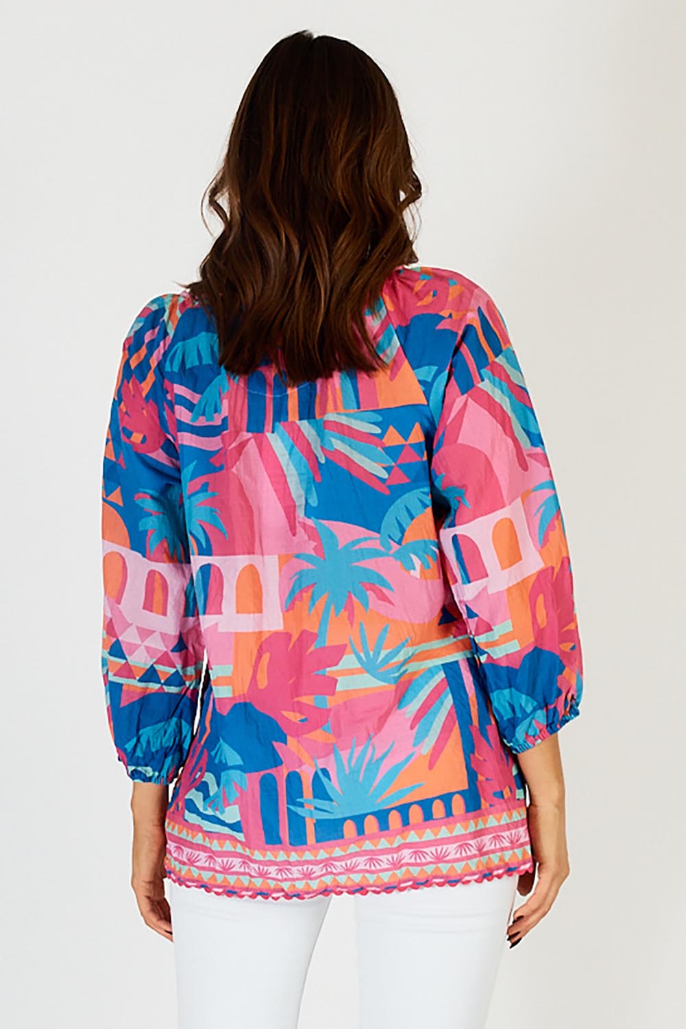 A model wearing the Rowanna Cotton Top in colour Blue (Blue), from the back