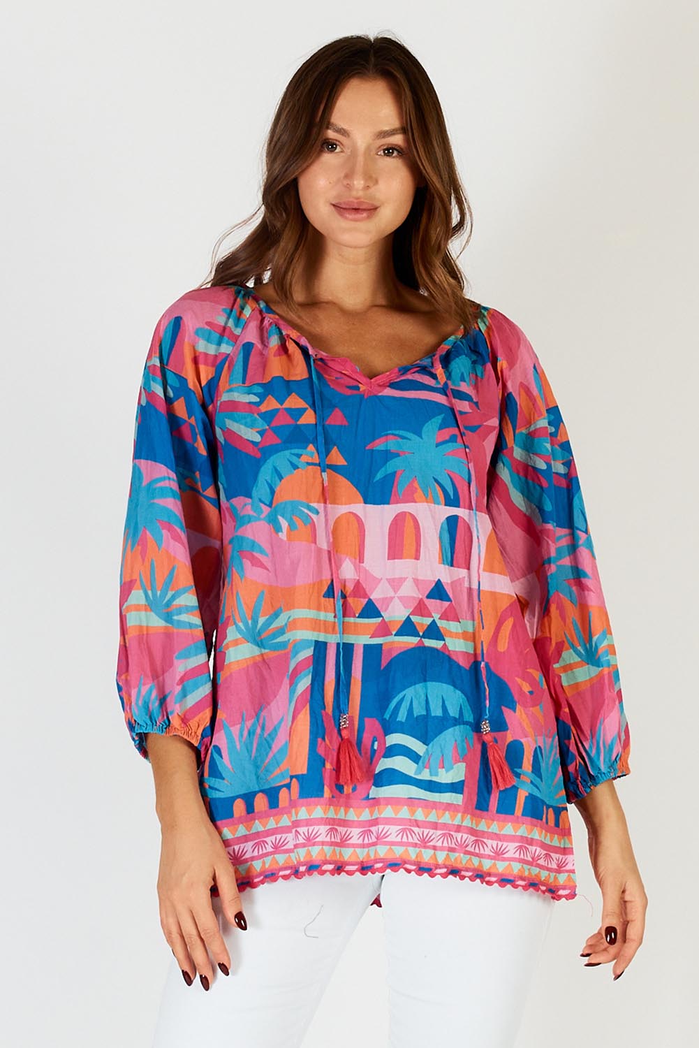 A model wearing the Rowanna Cotton Top in colour Blue (Blue), from the front, cropped image