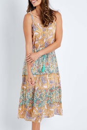 Model Amanda wearing size S of the Gaby Sundress in colour Sage, from the front, cropped image