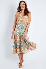 Model Amanda wearing size S of the Gaby Sundress in colour Sage, from the front, showing the whole outfit