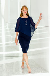 Model Katie wearing size 10 of the Cassandra Dress in colour Navy (Blue), from the front, showing the whole outfit