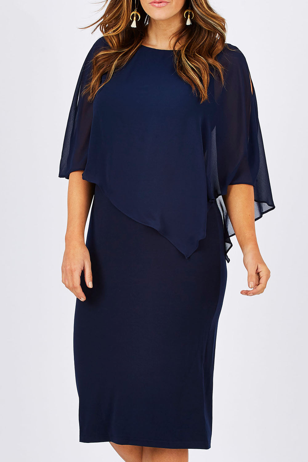 Model Laura wearing size 12 of the Cassandra Dress in colour Navy (Blue), from the front, cropped image