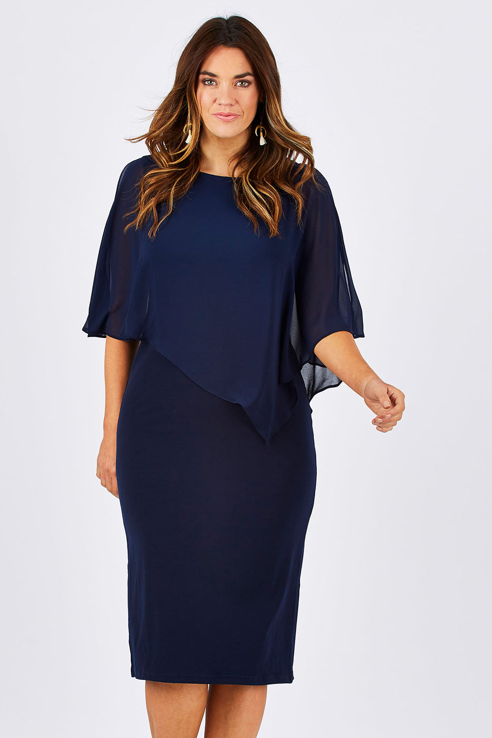 Model Laura wearing size 12 of the Cassandra Dress in colour Navy (Blue), from the front, cropped image
