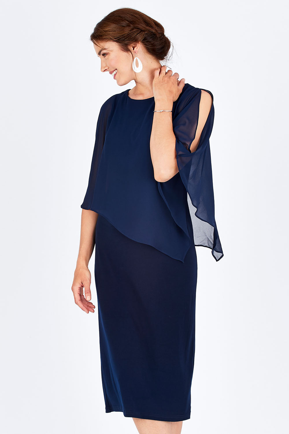 Model Rebecca wearing size 10 of the Cassandra Dress in colour Navy (Blue), from the front, cropped image