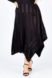 Model Sophie wearing size 14 of the Yen Skirt in colour Black (Black), from the front, cropped image