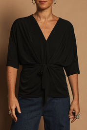 Model Katie wearing size 10 of the Niamh Top in colour Black (Black), from the front, cropped image