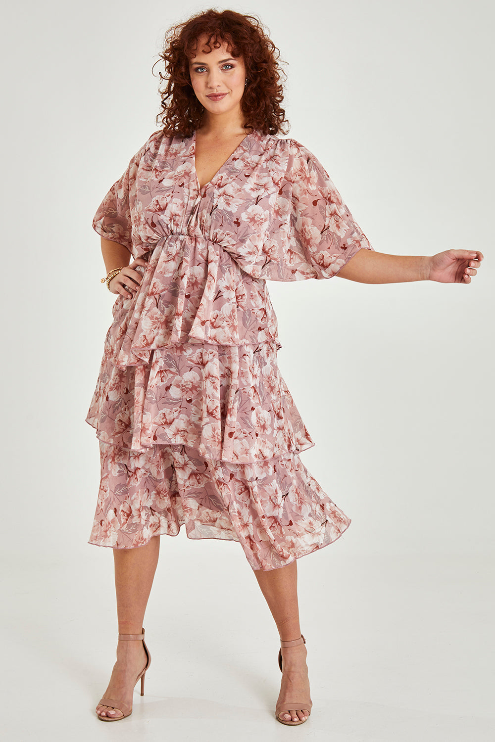 Model Maddy wearing size 16 of the Sadie Dress in colour Blushfleur (Pink), from the front, showing the whole outfit