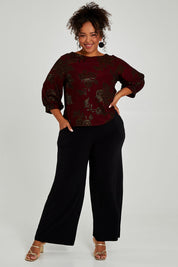 Model Alexis wearing size 18 of the Kristi Pants in colour Black (Black), from the front, showing the whole outfit