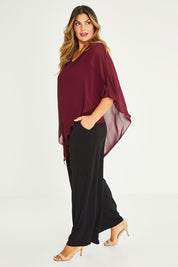 Model Palatina wearing size 16 of the Kristi Pants in colour Black (Black), from the front, showing the whole outfit
