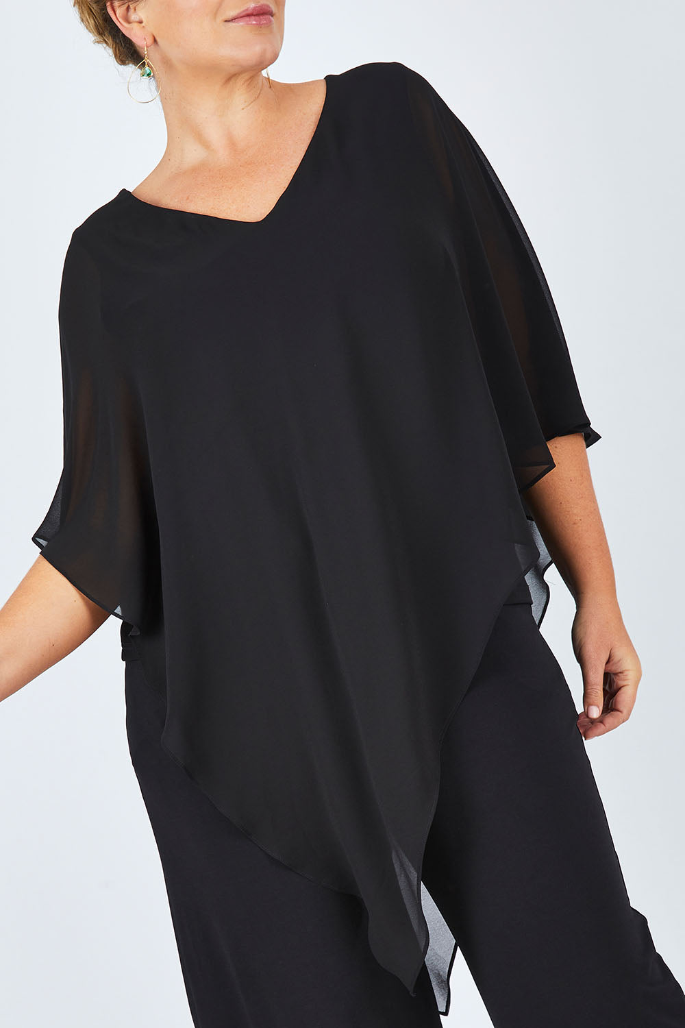 Model Fiona wearing size 16 of the Marie Top in colour Black (Black), from the front, cropped image