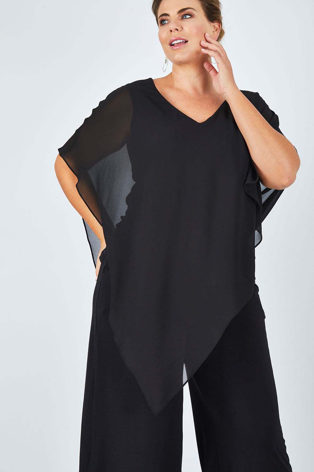 Model Fiona wearing size 16 of the Marie Top in colour Black (Black), from the front, cropped image