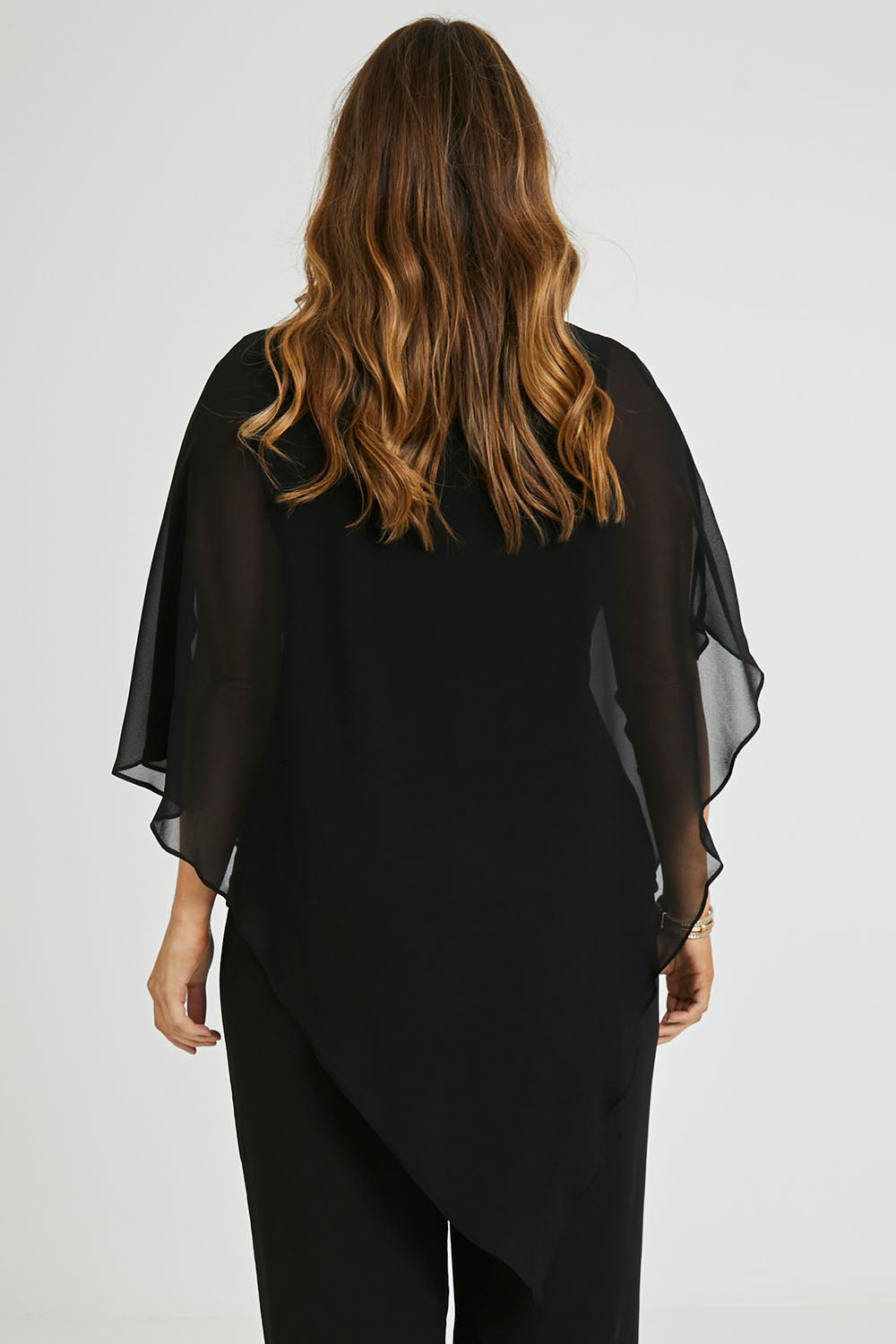 Model Laura wearing size 14 of the Marie Top in colour Black (Black), from the back
