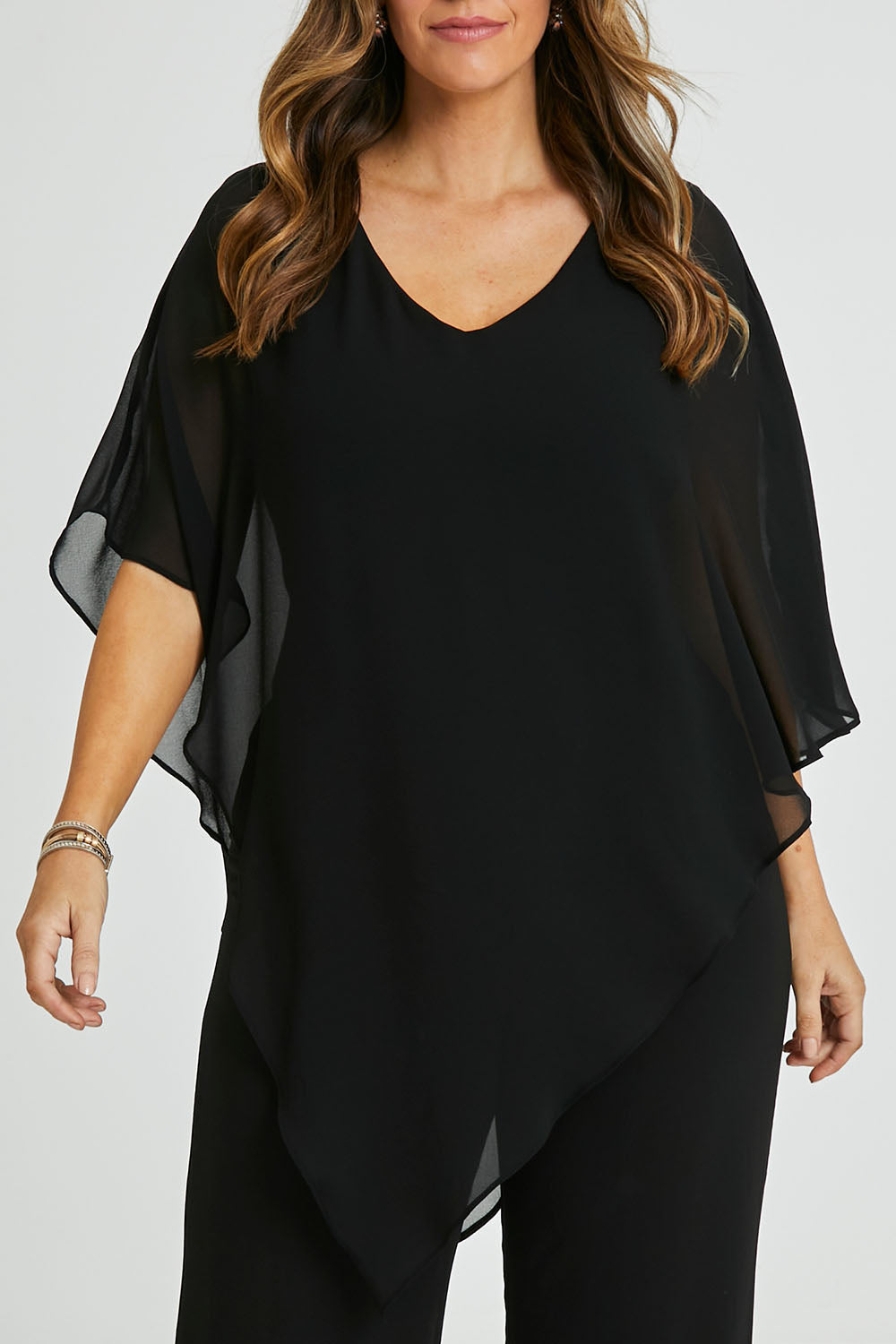 Model Laura wearing size 14 of the Marie Top in colour Black (Black), from the front, cropped image