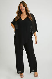 Model Laura wearing size 14 of the Marie Top in colour Black (Black), from the front, showing the whole outfit