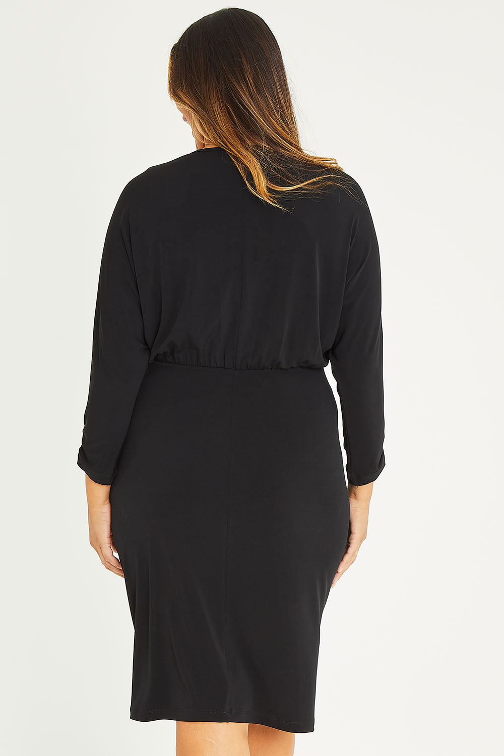 Model Palatina wearing size 16 of the Nancy Dress in colour Black (Black), from the back
