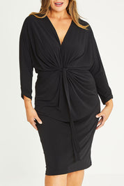 Model Palatina wearing size 16 of the Nancy Dress in colour Black (Black), from the front, cropped image