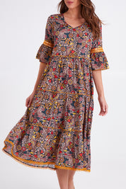 Model Madeline wearing size S of the Avlon Midi in colour Beatrix (Black), from the front, cropped image