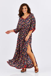 Model Chesska wearing size M of the Flamingo Dress Roza Print in colour Navy (Blue), from the front, showing the whole outfit