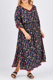 Model Ljubenka wearing size XXL of the Flamingo Dress Roza Print in colour Navy (Blue), from the front, cropped image