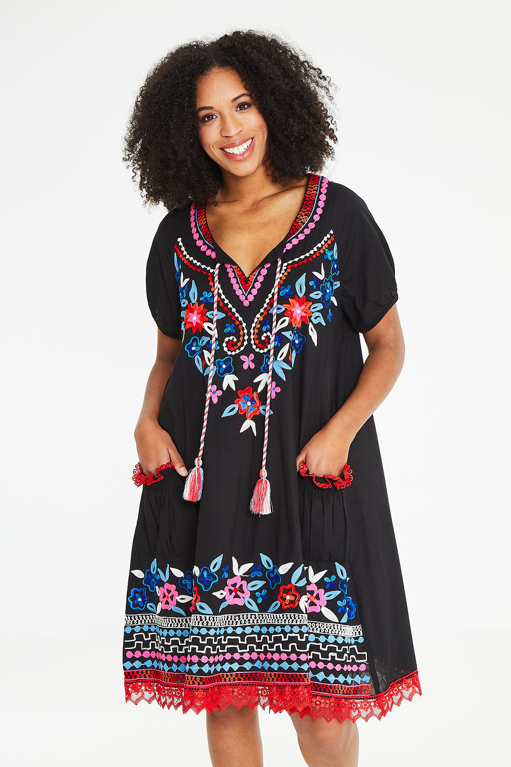Model Schanez wearing size S of the Sao Paulo Dress Nova in colour Floralemb (Black), from the front, cropped image