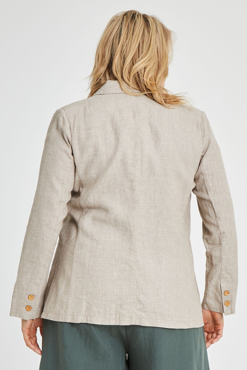 Model Keeara wearing size 16 of the Cotton Linen Longline Blazer in colour Desertsand, from the back