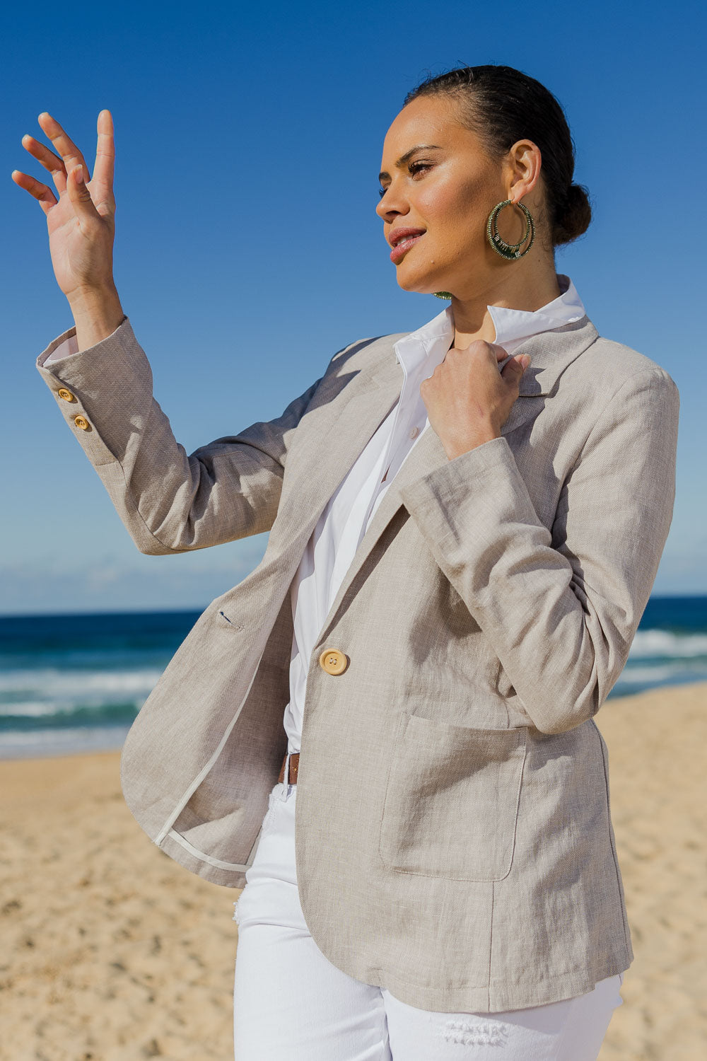 Model Lala wearing size 10 of the Cotton Linen Longline Blazer in colour Desertsand, from the front, cropped image