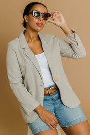 Model Noli wearing size 14 of the Cotton Linen Longline Blazer in colour Desertsand, from the front, showing the whole outfit