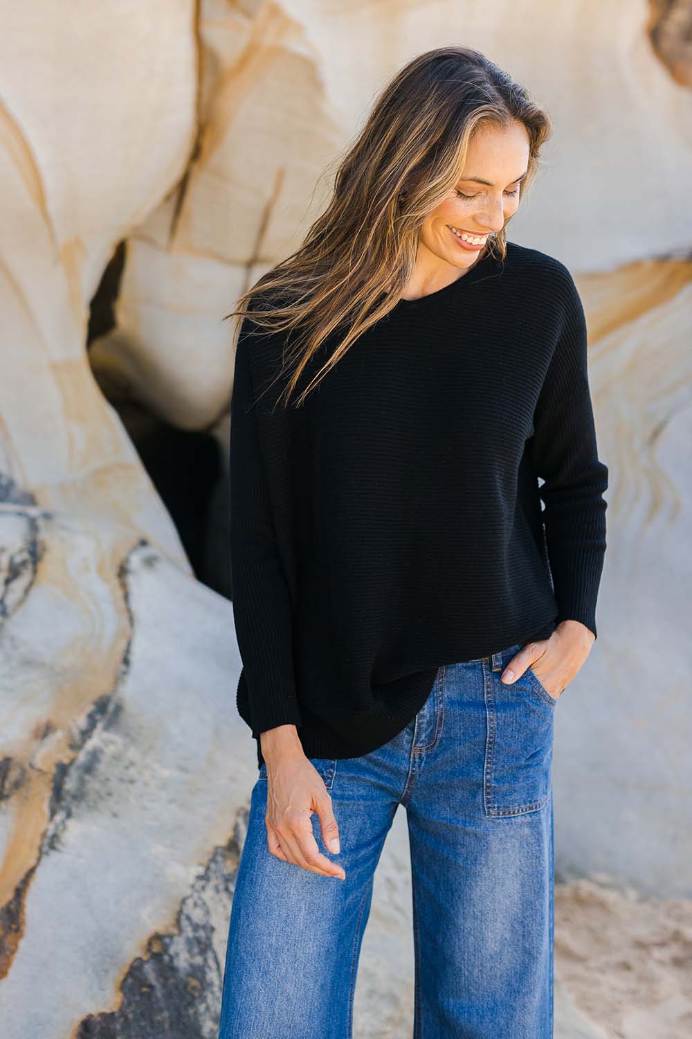 Model Amanda wearing size S of the Wool Cashmere Relaxed V Neck Jumper in colour Black (Black), from the front, showing the whole outfit