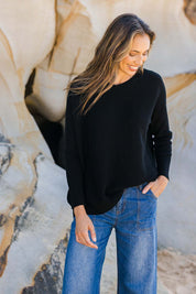 Model Amanda wearing size S of the Wool Cashmere Relaxed V Neck Jumper in colour Black (Black), from the front, showing the whole outfit
