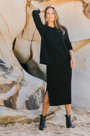 Model Amanda wearing size S of the Wool Cashmere Relaxed V Neck Jumper in colour Black (Black), from the front, showing the whole outfit