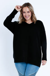 Model Jess wearing size L of the Wool Cashmere Relaxed V Neck Jumper in colour Black (Black), from the front, cropped image