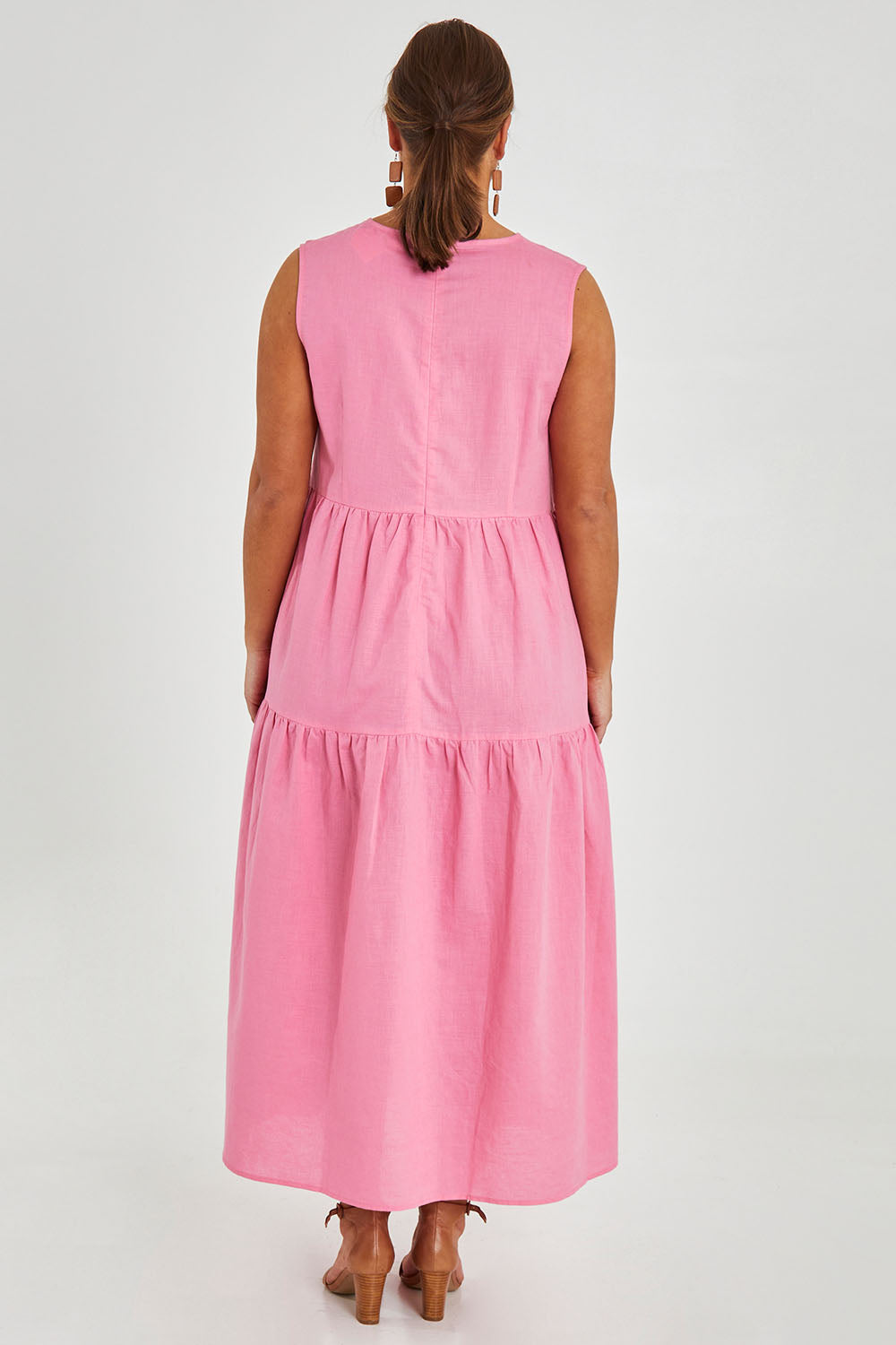 Model Monique wearing size 14 of the Linen Cotton Sleeveless Maxi Dress in colour Pink (Pink), from the back