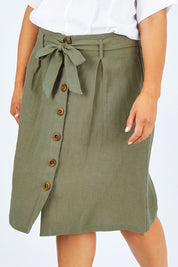 Model Palatina wearing size 14 of the Linen Ain colourline Skirt - Fern (Green), from the front, cropped image