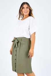 Model Palatina wearing size 14 of the Linen Ain colourline Skirt - Fern (Green), from the front, cropped image