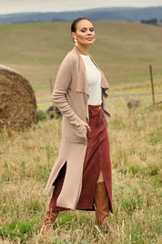 Model Lala wearing size S of the Cotton Cashmere Waterfall Cardigan in colour Lighttaupe, from the front, showing the whole outfit