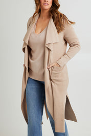 Model Laura wearing size L of the Cotton Cashmere Waterfall Cardigan in colour Lighttaupe, from the front, cropped image