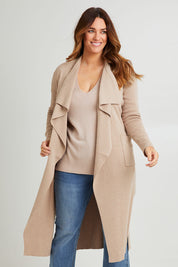 Model Laura wearing size L of the Cotton Cashmere Waterfall Cardigan in colour Lighttaupe, from the front, cropped image