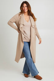 Model Laura wearing size L of the Cotton Cashmere Waterfall Cardigan in colour Lighttaupe, from the front, showing the whole outfit