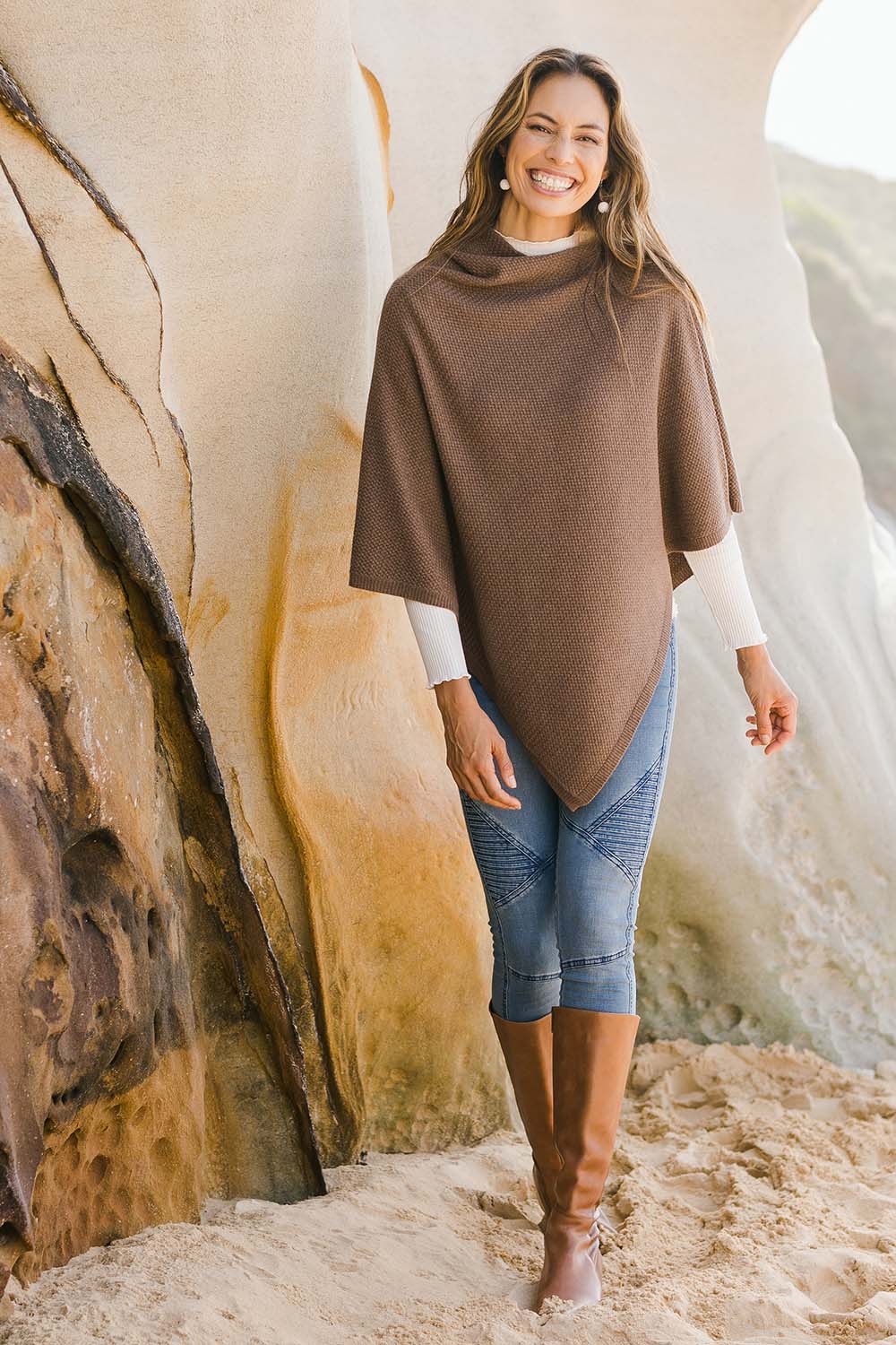 Model Amanda wearing size S of the Cotton Cashmere Wool Poncho in colour Richearth, from the front, showing the whole outfit
