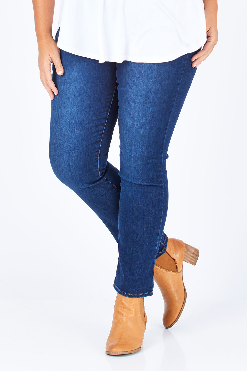 Model Fiona wearing the Sheri Slim in colour Cooper (Blue), from the front, cropped image