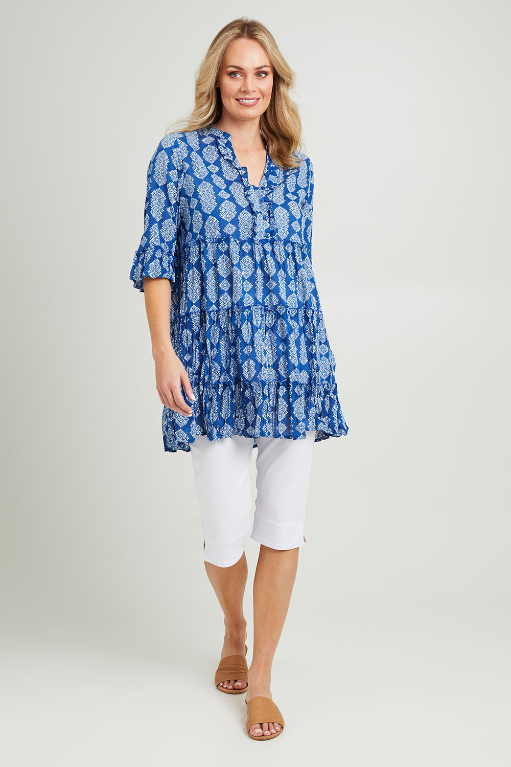 Model Grace wearing size 10 of the Angelina 3/4 Sleeve Tunic in colour Navy (Blue), from the front, showing the whole outfit